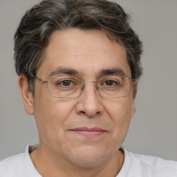 Joyful white middle-aged male with short  brown hair and brown eyes