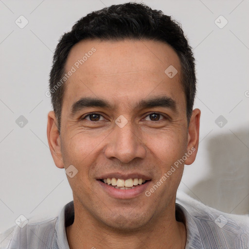 Joyful white young-adult male with short  black hair and brown eyes