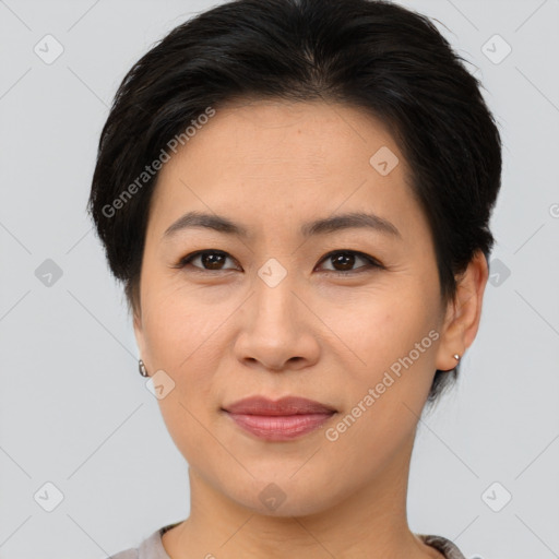 Joyful asian young-adult female with short  brown hair and brown eyes