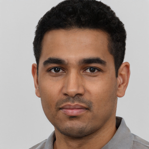 Neutral latino young-adult male with short  black hair and brown eyes