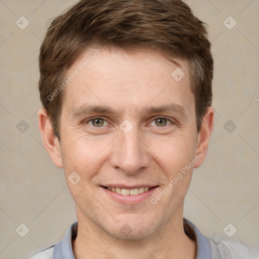 Joyful white adult male with short  brown hair and grey eyes