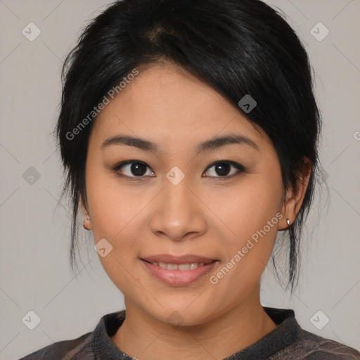 Joyful asian young-adult female with medium  black hair and brown eyes