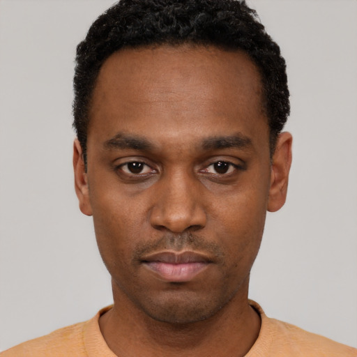 Neutral black young-adult male with short  black hair and brown eyes