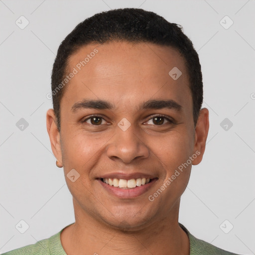 Joyful latino young-adult male with short  black hair and brown eyes