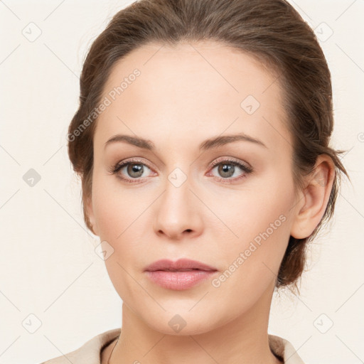 Joyful white young-adult female with medium  brown hair and green eyes