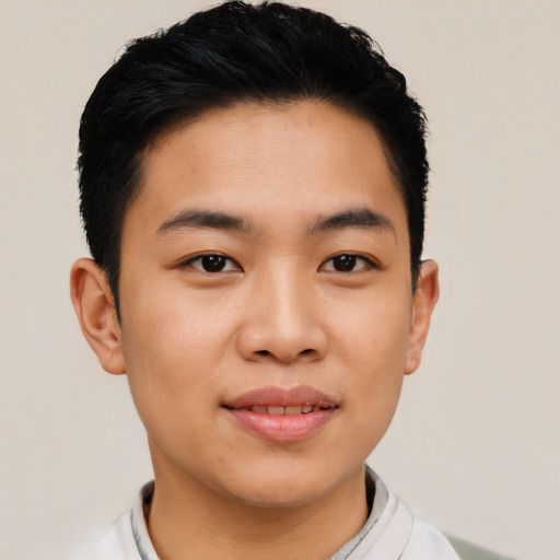 Joyful asian young-adult male with short  black hair and brown eyes