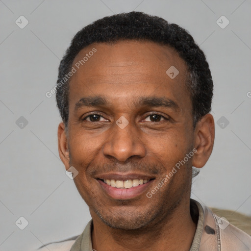 Joyful latino adult male with short  black hair and brown eyes