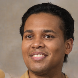 Joyful latino young-adult male with short  brown hair and brown eyes