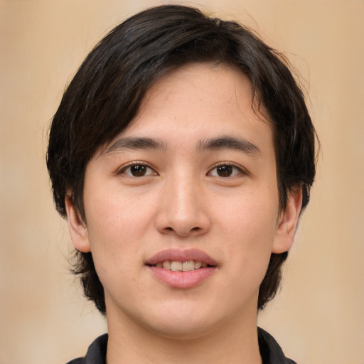 Joyful white young-adult male with medium  brown hair and brown eyes