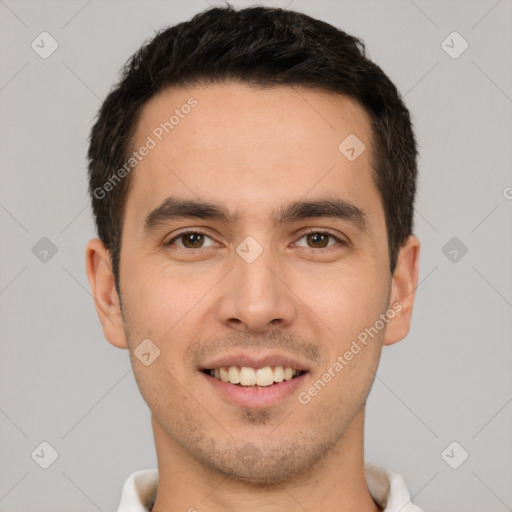 Joyful white young-adult male with short  brown hair and brown eyes