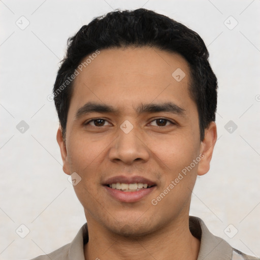 Joyful asian young-adult male with short  black hair and brown eyes