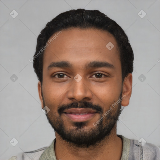 Joyful black young-adult male with short  black hair and brown eyes