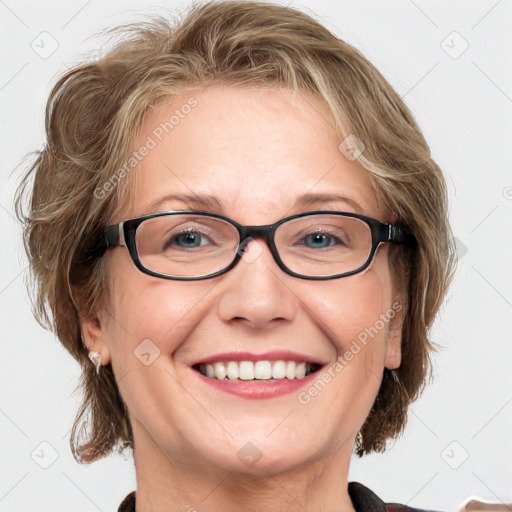 Joyful white adult female with medium  brown hair and blue eyes