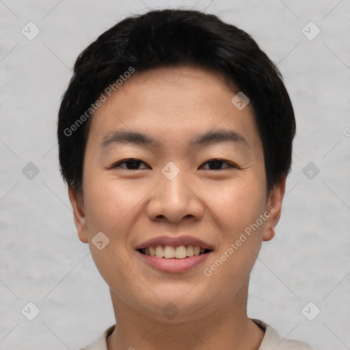 Joyful asian young-adult male with short  black hair and brown eyes