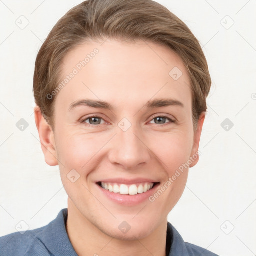 Joyful white young-adult female with short  brown hair and grey eyes