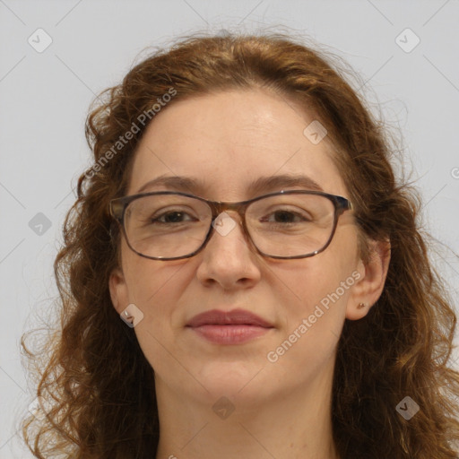 Joyful white adult female with long  brown hair and green eyes