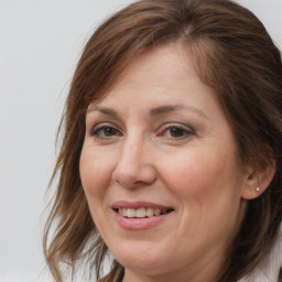 Joyful white adult female with medium  brown hair and grey eyes