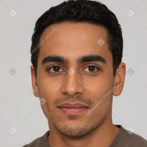 Neutral latino young-adult male with short  black hair and brown eyes