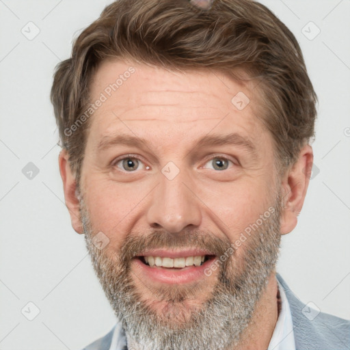 Joyful white adult male with short  brown hair and grey eyes