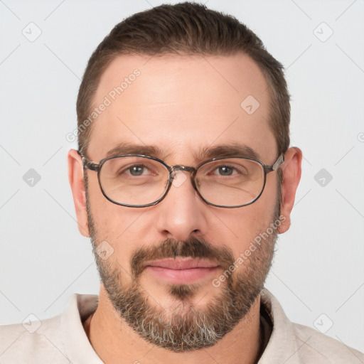 Joyful white adult male with short  brown hair and brown eyes