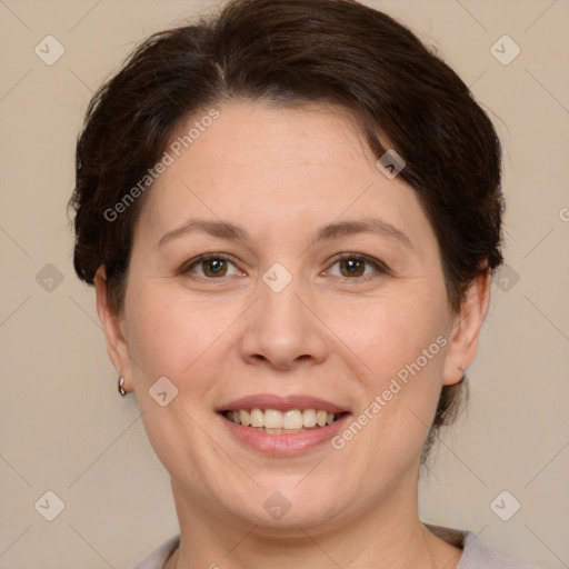 Joyful white adult female with short  brown hair and brown eyes