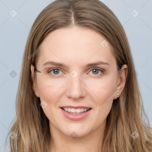 Joyful white young-adult female with long  brown hair and grey eyes