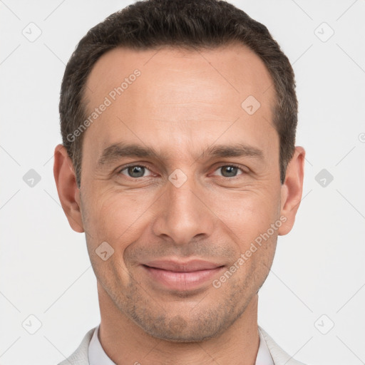 Joyful white adult male with short  brown hair and brown eyes