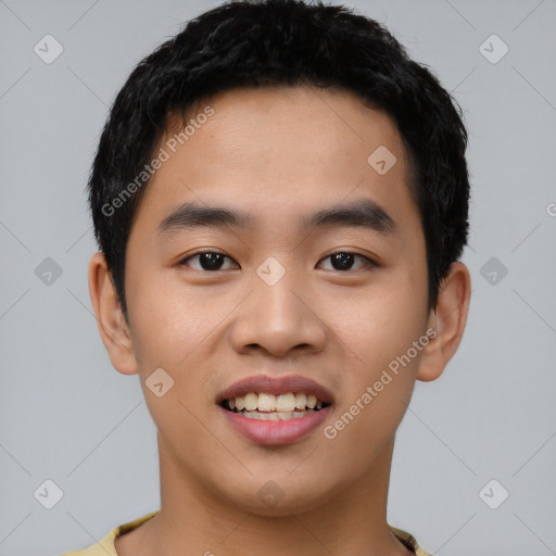 Joyful asian young-adult male with short  black hair and brown eyes