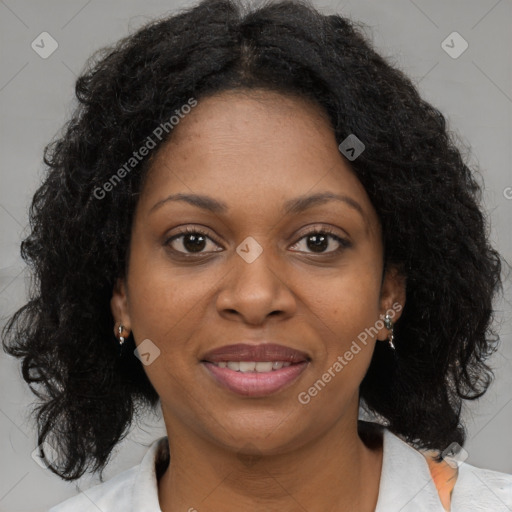 Joyful black adult female with medium  brown hair and brown eyes