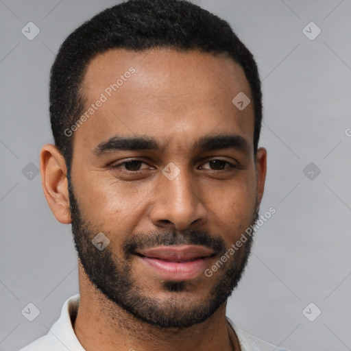 Joyful black young-adult male with short  black hair and brown eyes