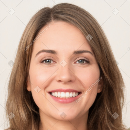 Joyful white young-adult female with long  brown hair and green eyes