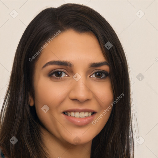 Joyful latino young-adult female with long  brown hair and brown eyes