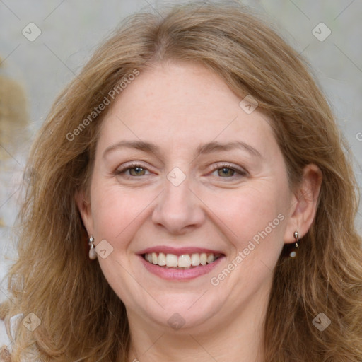 Joyful white adult female with long  brown hair and brown eyes