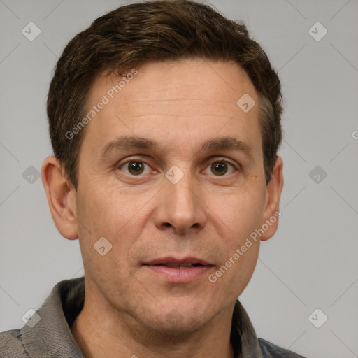 Joyful white adult male with short  brown hair and grey eyes