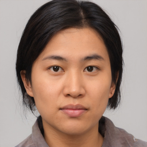 Neutral asian young-adult female with medium  brown hair and brown eyes