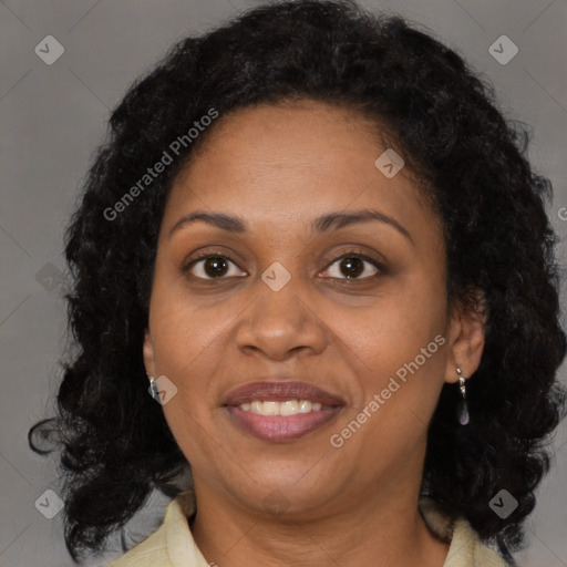 Joyful black adult female with medium  brown hair and brown eyes