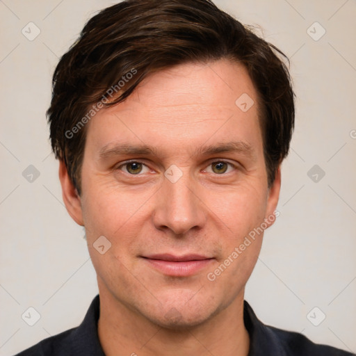 Joyful white adult male with short  brown hair and grey eyes