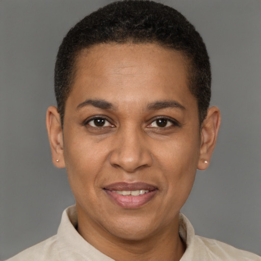 Joyful latino adult female with short  brown hair and brown eyes