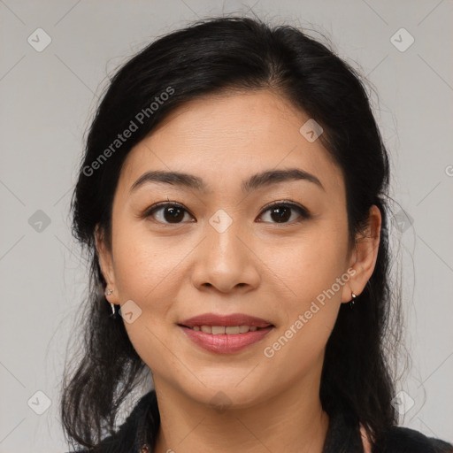 Joyful latino young-adult female with medium  brown hair and brown eyes