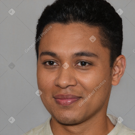 Joyful black young-adult male with short  black hair and brown eyes