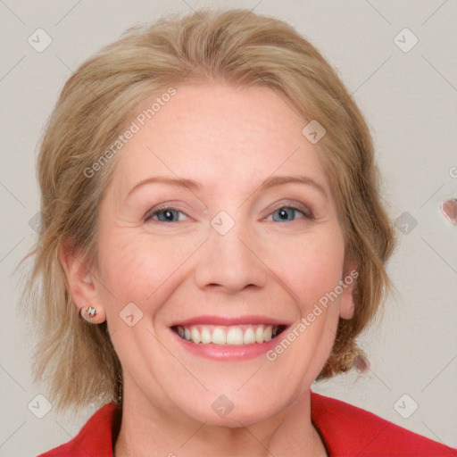 Joyful white adult female with medium  brown hair and blue eyes