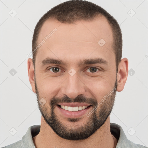 Joyful white young-adult male with short  brown hair and brown eyes