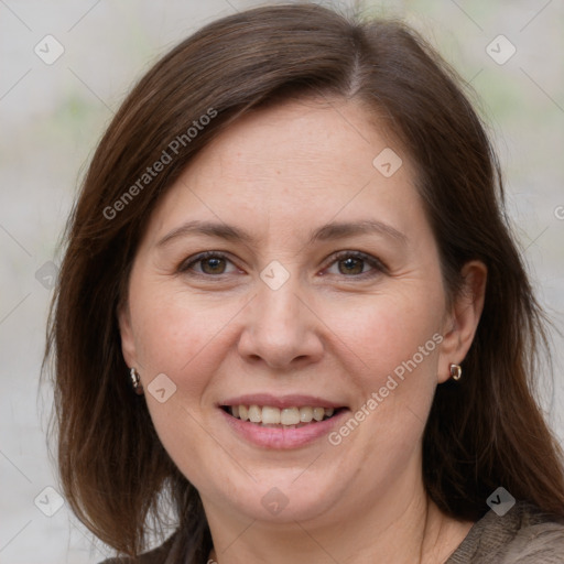 Joyful white adult female with medium  brown hair and brown eyes