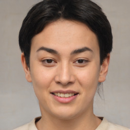 Joyful asian young-adult female with short  brown hair and brown eyes