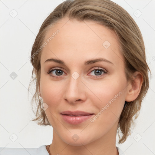 Joyful white young-adult female with medium  brown hair and blue eyes