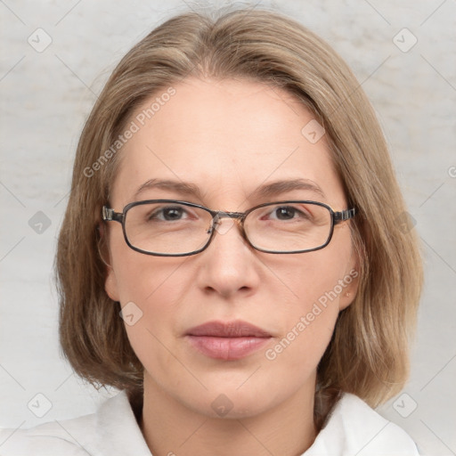 Joyful white adult female with medium  brown hair and blue eyes