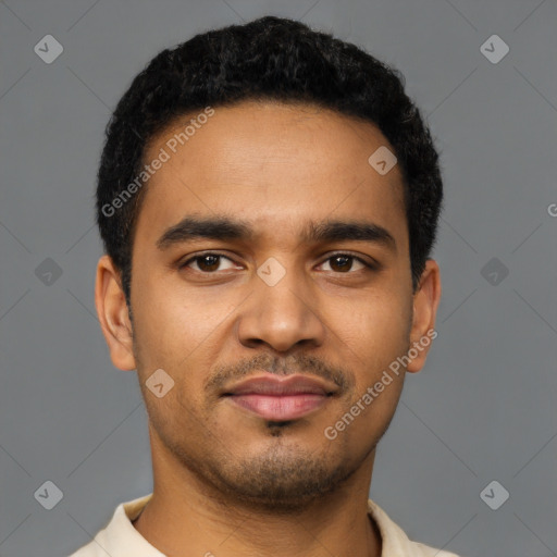 Joyful latino young-adult male with short  brown hair and brown eyes