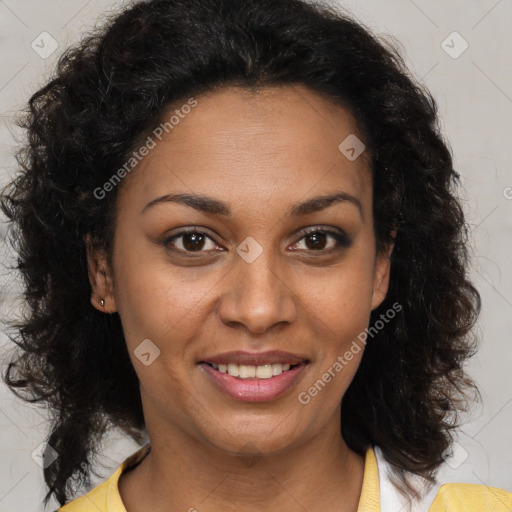 Joyful black adult female with medium  brown hair and brown eyes