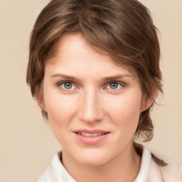 Joyful white young-adult female with medium  brown hair and grey eyes