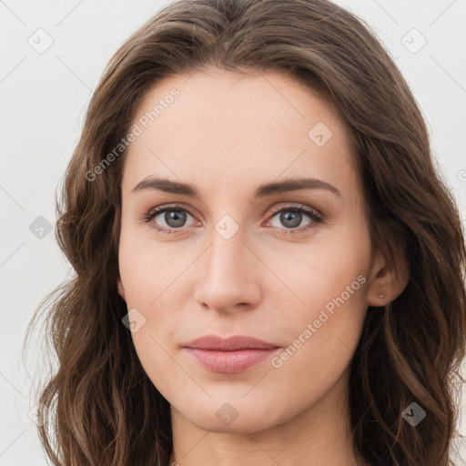 Joyful white young-adult female with long  brown hair and green eyes